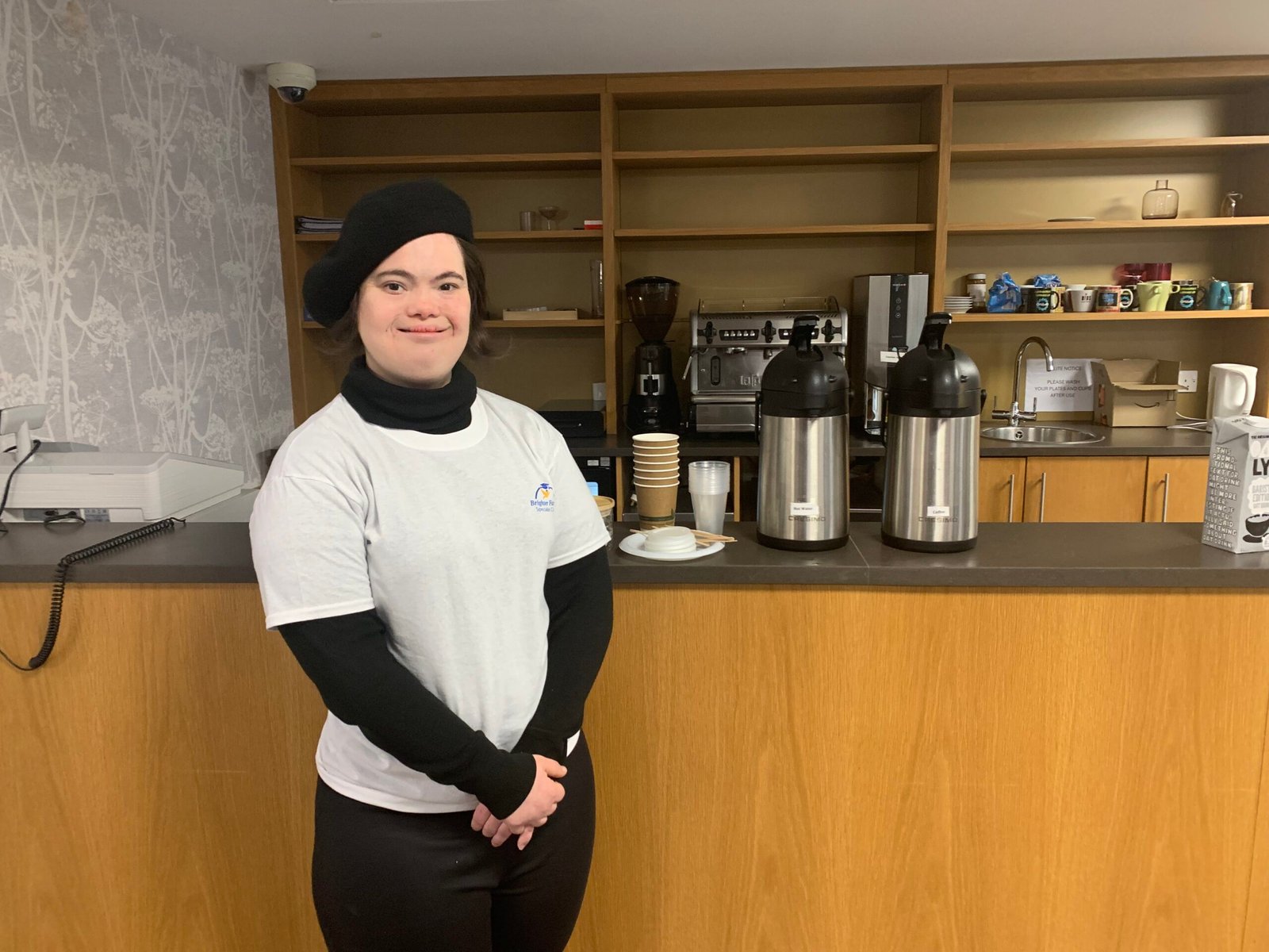 Smiling student in front of cafe